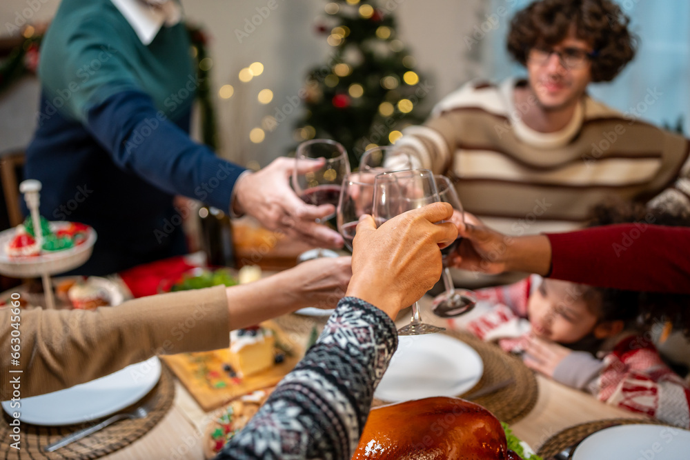 Close up of big family celebrating Christmas party together in house. 