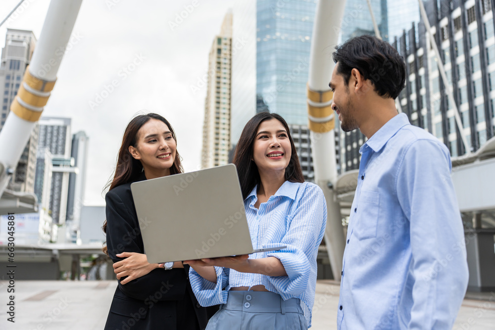 Group of Asian businessman and businesswoman work outdoor in the city. 