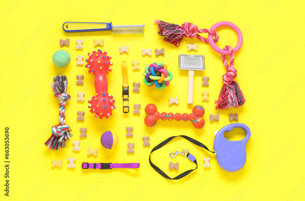 Composition with different pet care accessories and dry food on yellow background