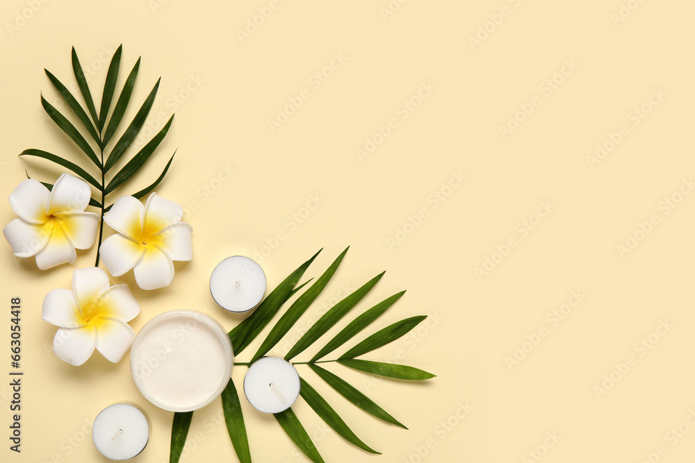 Composition with jar of cream, candles, palm leaves and flowers on color background