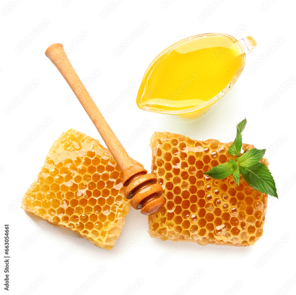 Gravy boat with sweet honey, combs and dipper on white background