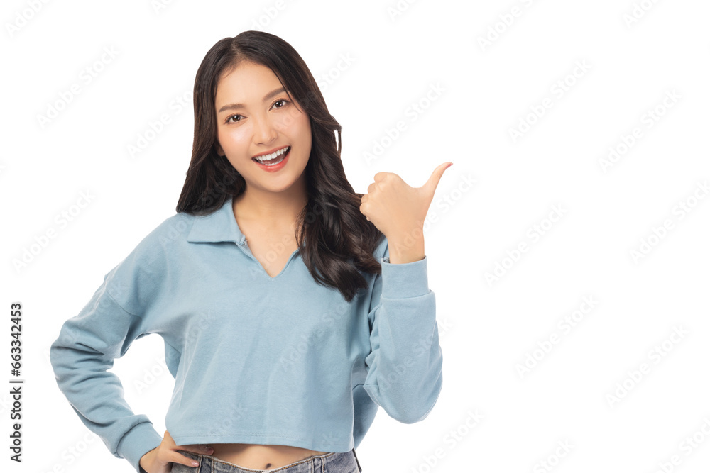 Beautiful young Asian woman pointing up to copy space and looking at camera with smile face and happy Pretty girl act like a satisfied product, use for advertising with isolated on white background