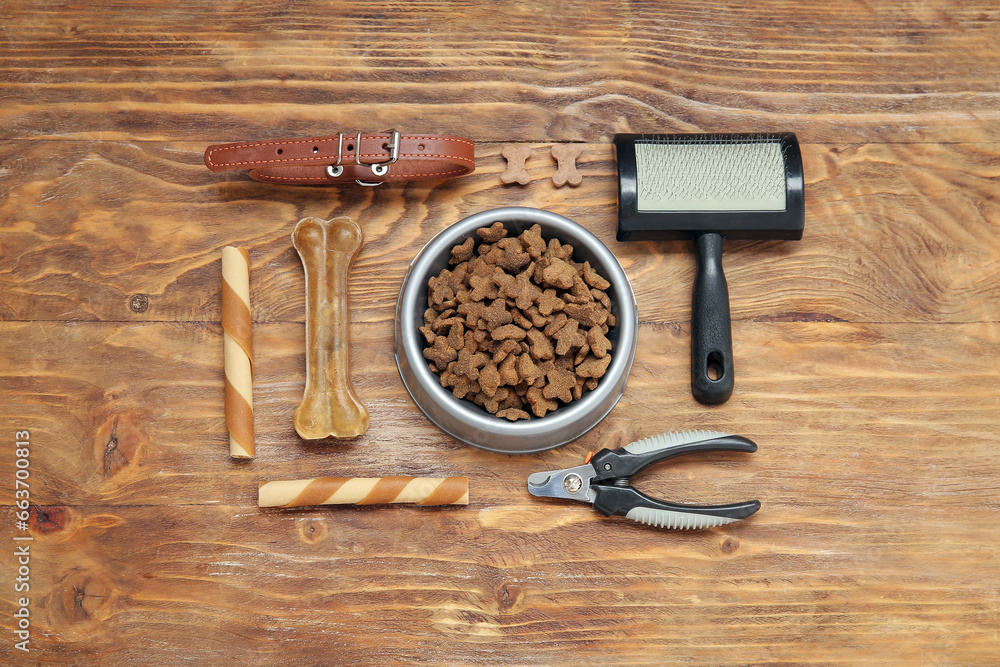 Composition with different pet food and accessories on wooden background