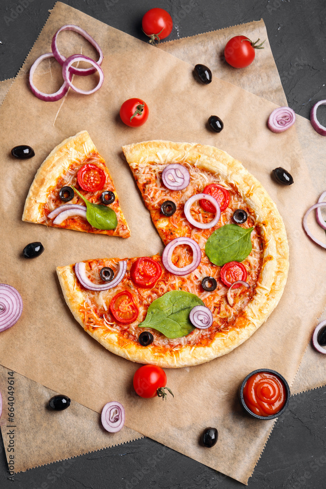 Baking paper of tasty pizza with olives and tomatoes on black background