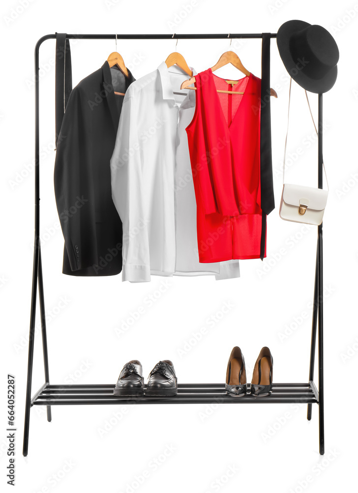 Rack with stylish clothes, shoes and accessories on white background