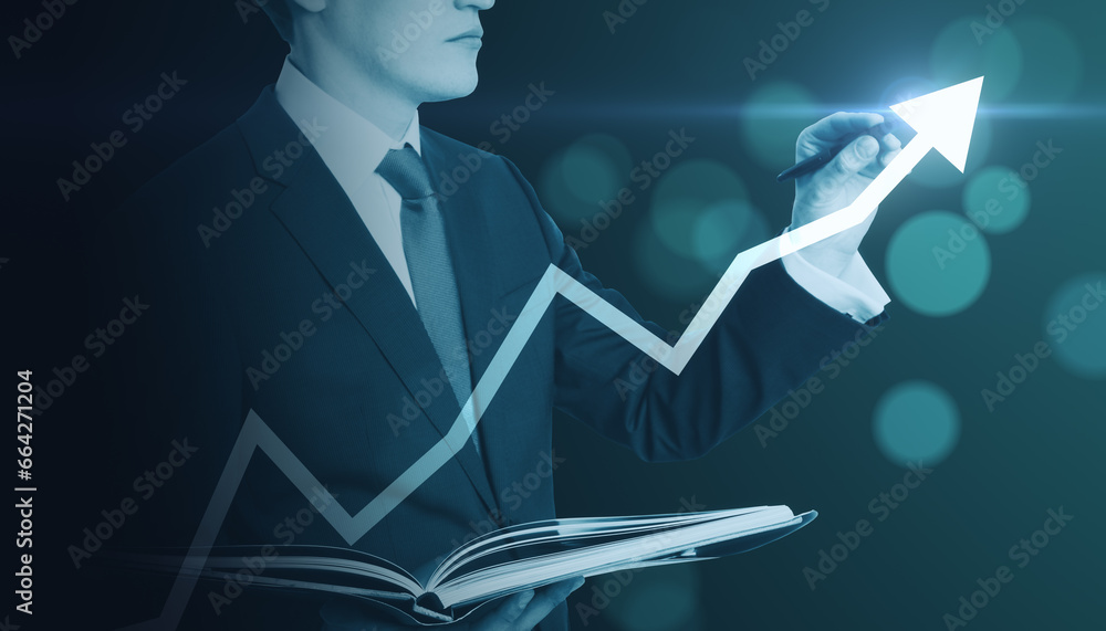 Close up of businessman with book pointing at creative glowing upward arrow on blurry glowing blue bokeh circles background. Growth, success business and up concept. Toned image.