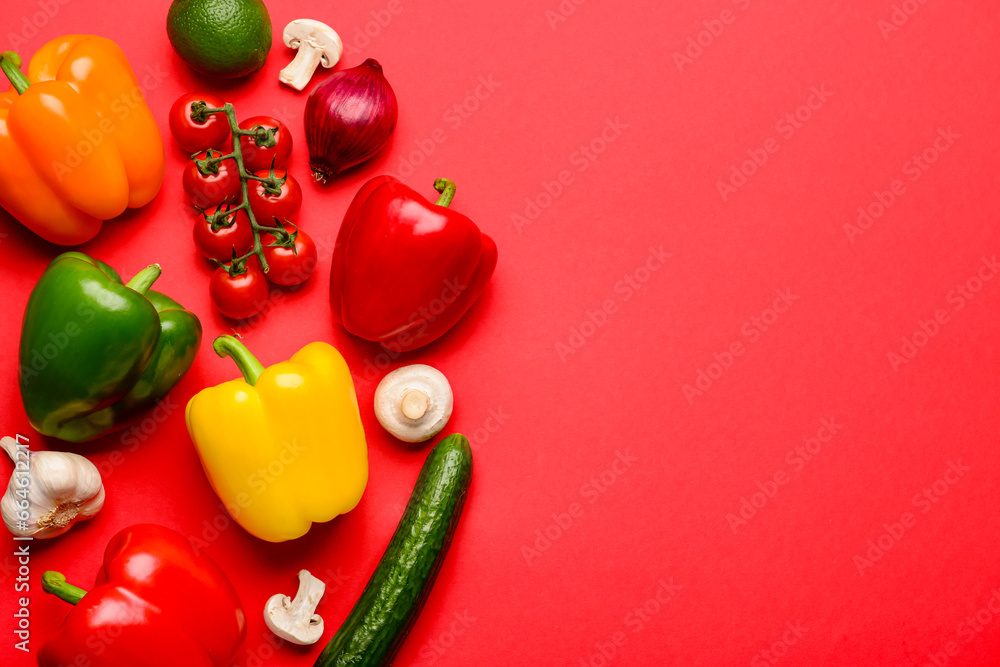 Fresh vegetables and fruits with mushrooms on red background