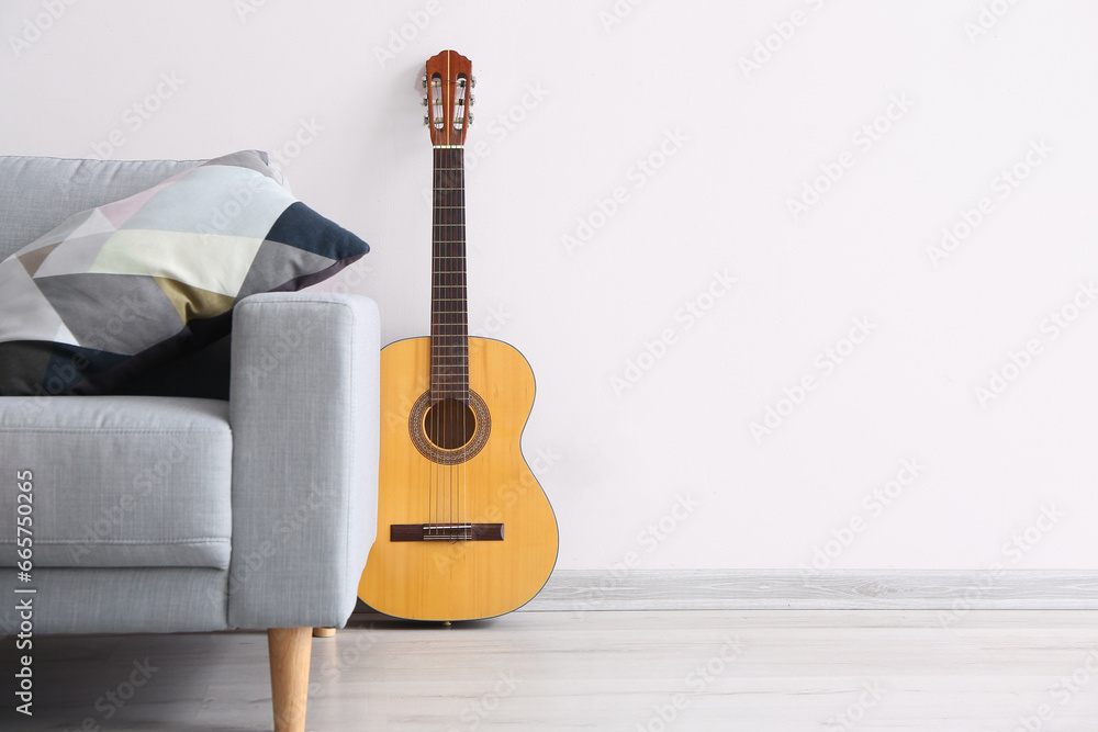 Sofa and guitar in modern room