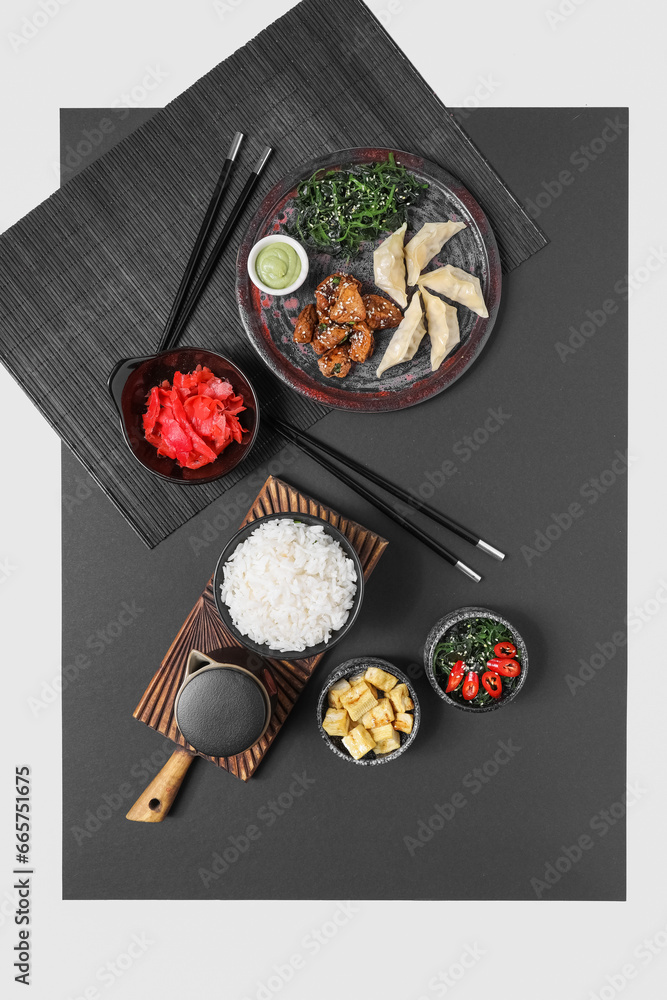 Composition with different Chinese dishes on black and white background