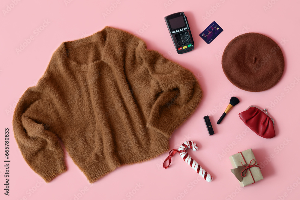 Composition with stylish female clothes, accessories and payment terminal on pink background