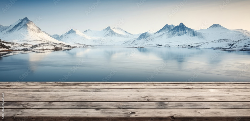 Empty top wooden boards table with Arctic sea and some snow covered mountains background, Winter weather product display.