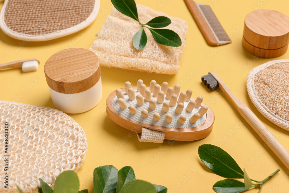 Composition with cosmetic products and bath supplies on yellow background, closeup