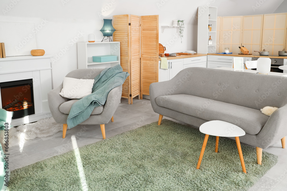 Interior of room with sofa and kitchen counters