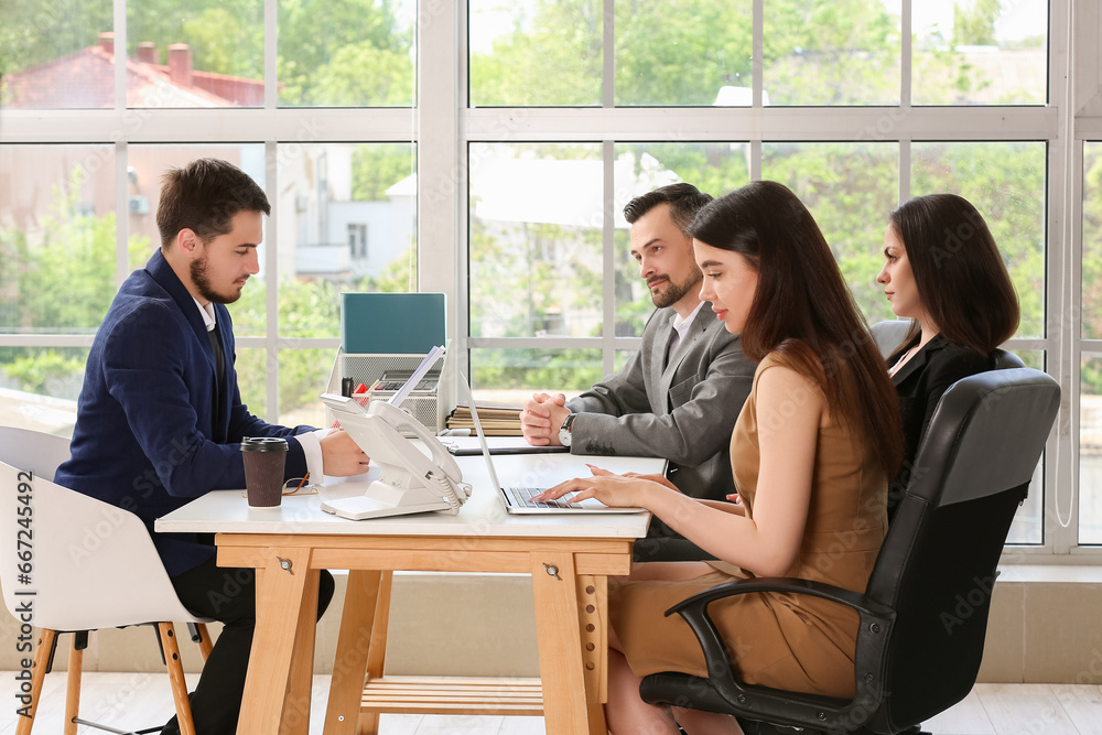 Human resources commission interviewing male applicant in office