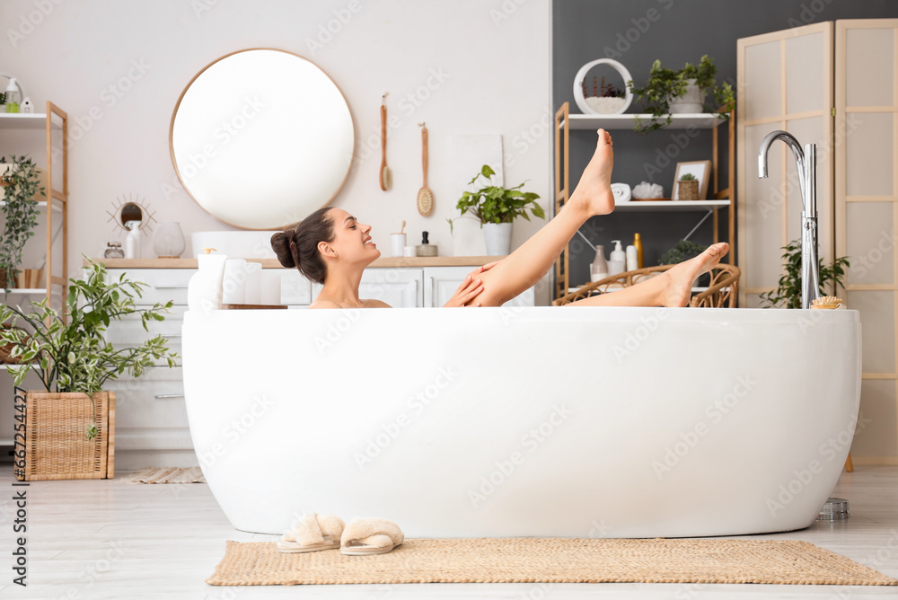 Young woman taking bath at home