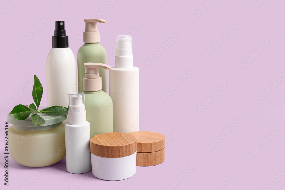 Set of different cosmetic products on lilac background