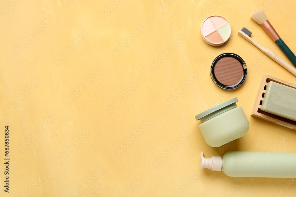 Set of different cosmetic products on yellow background