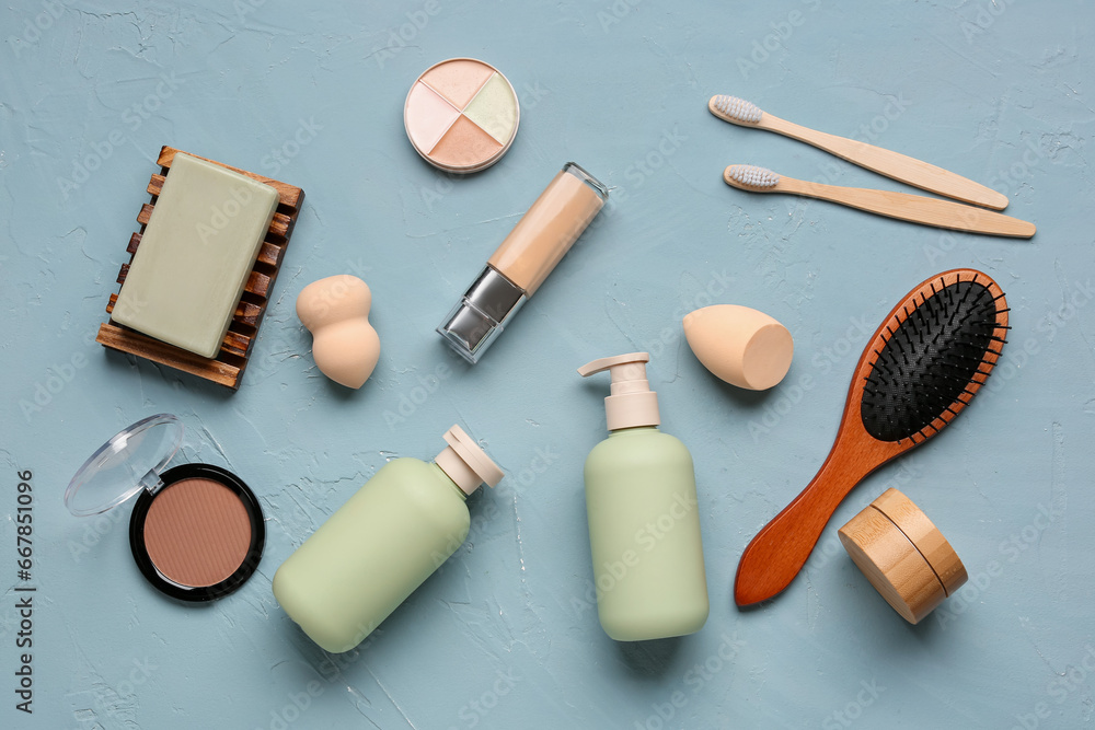 Composition with cosmetic products and bath accessories on color background