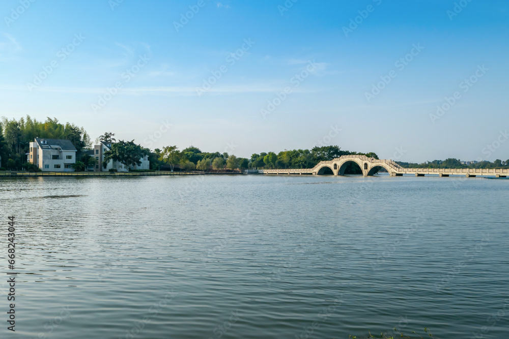 Stone arch bridge on the lake，Beautiful Longshui Lake Wetland Park, Chongqing, China