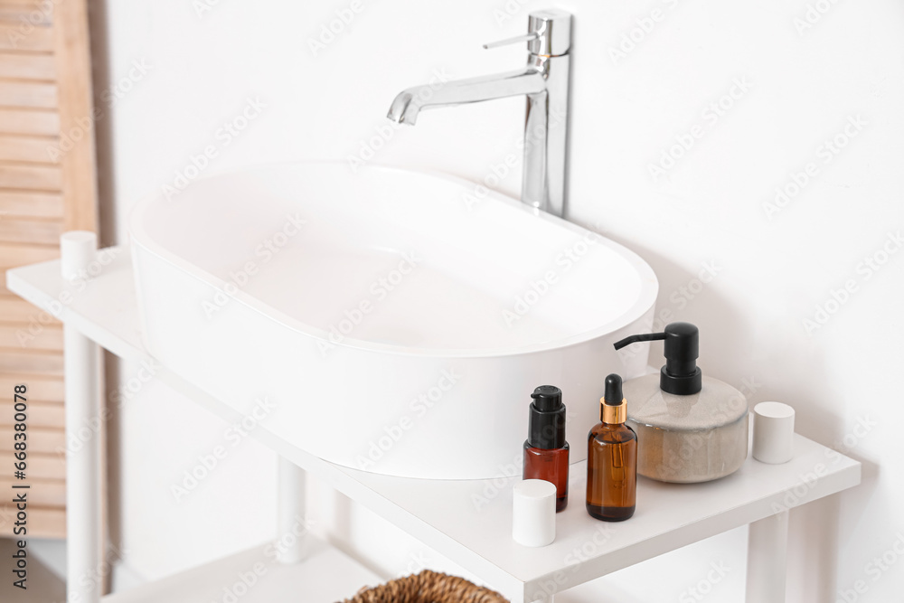 Sink with bath accessories in room