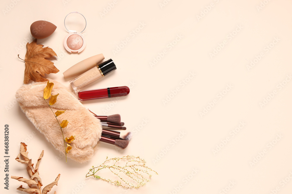 Composition with cosmetic products and autumn leaves on light background