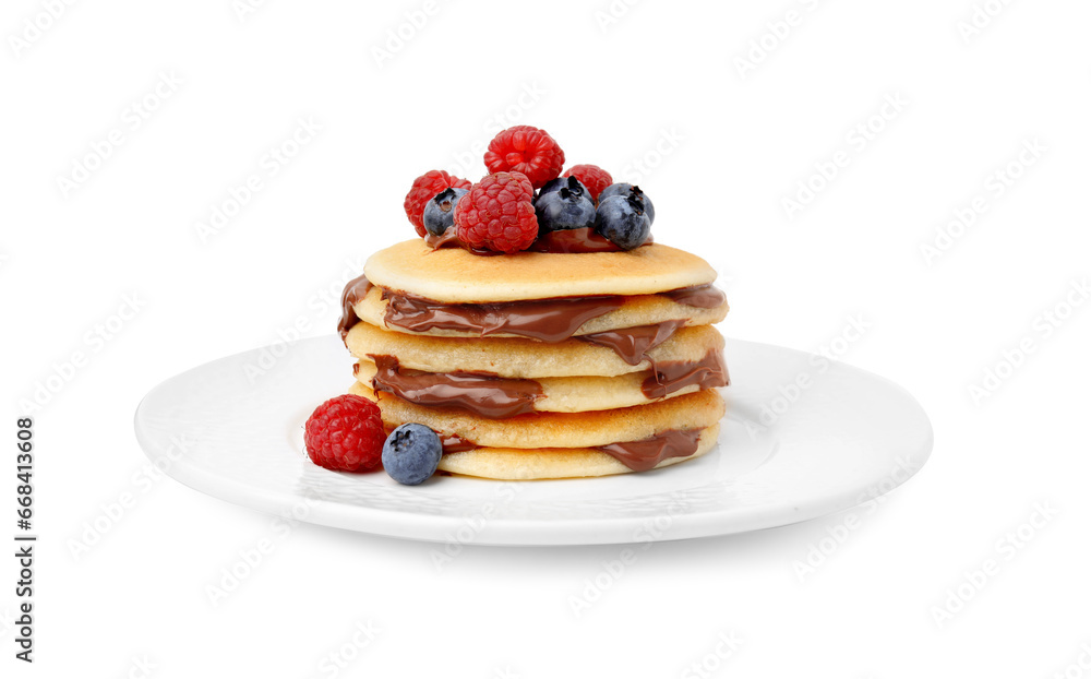 Stack of tasty pancakes with chocolate spread and berries isolated on white