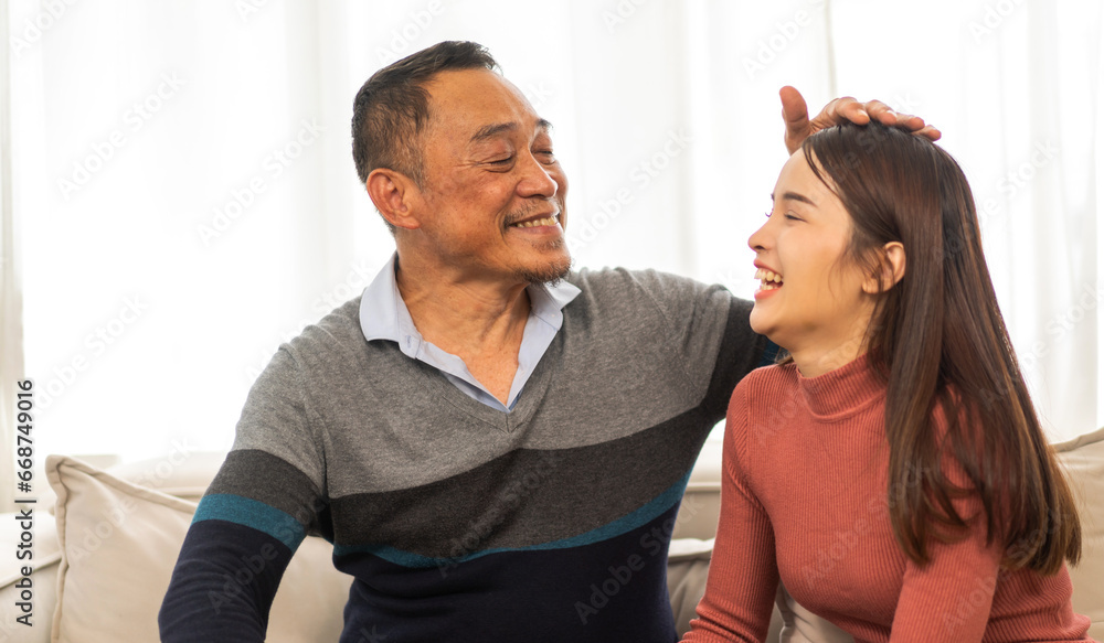 Portrait of enjoy happy love asian family senior mature father and young daughter smiling play laughing and having fun together at home, care, elderly, insurance.happy family and Father Day concept