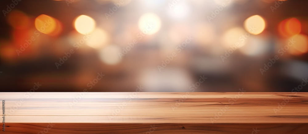 Abstract blurred coffee shop background with a wooden table top perfect for creating product displays