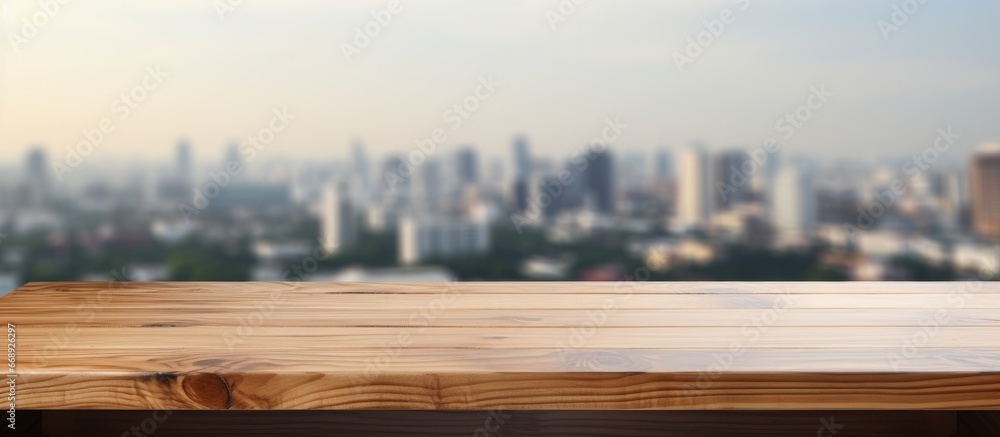 Wooden table surface in blurred building hallway background suitable for product display or montage