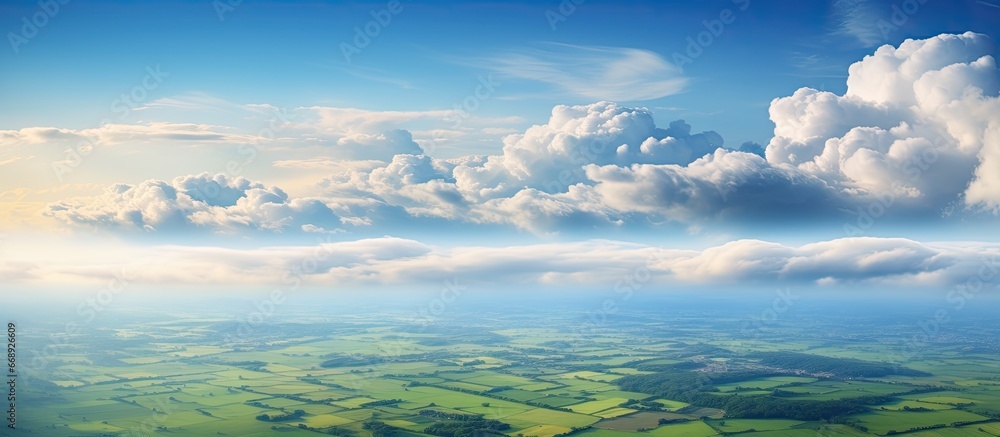 Aerial perspective of the land fields and clouds