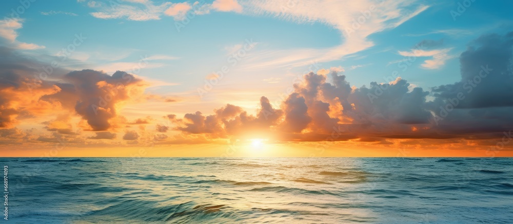 Sun appears over ocean at sunset in Naples Florida