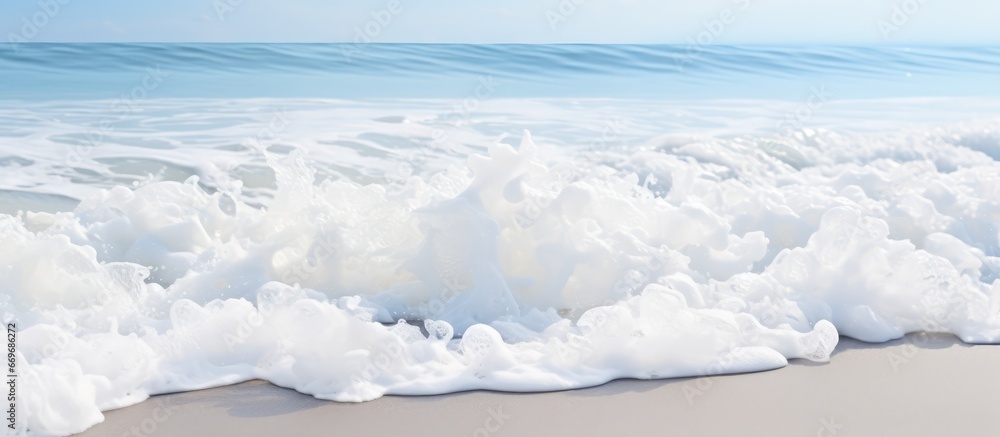 Foamy white waves on the beach