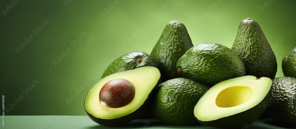 a bunch of ripe green avocados