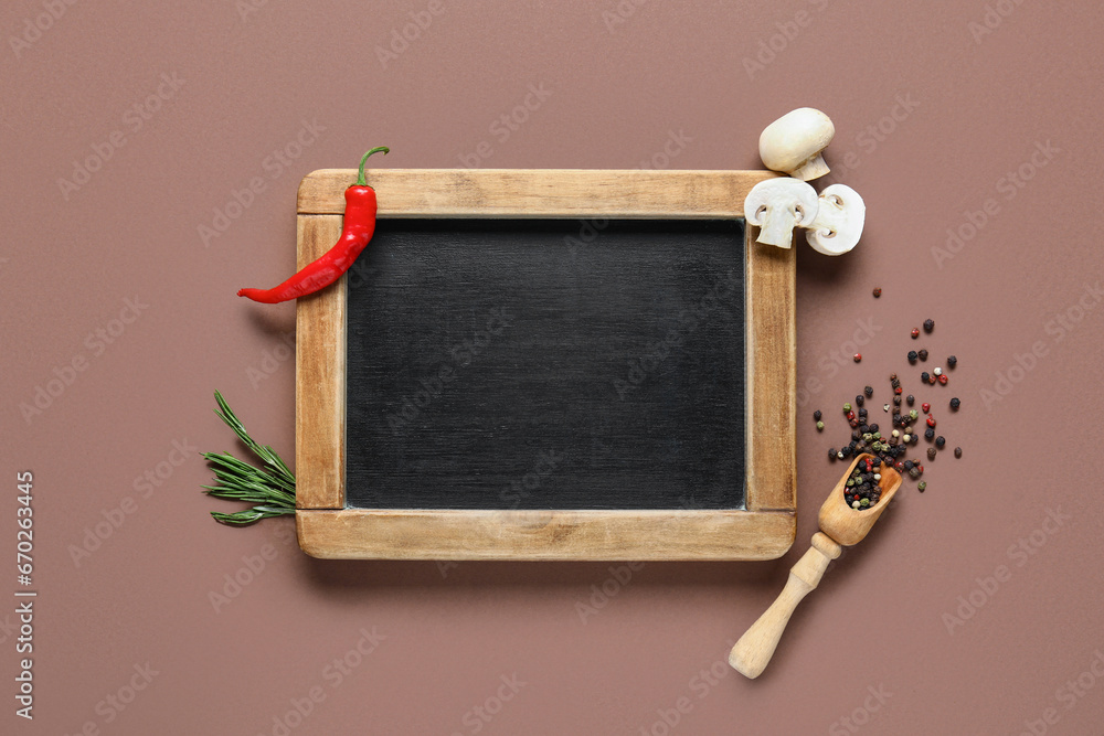 Composition with blank chalkboard, spices and mushrooms on color background