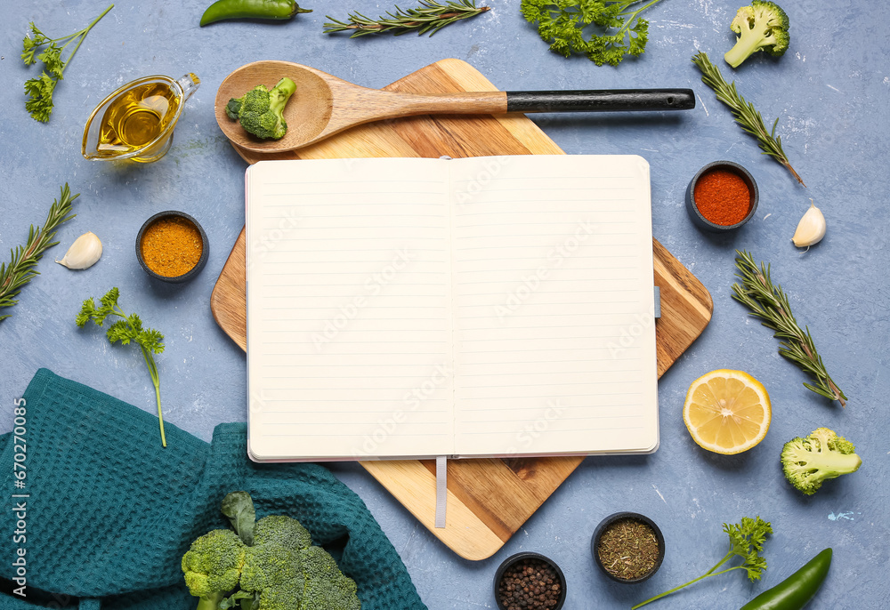 Composition with blank recipe book, fresh herbs and spices on color background