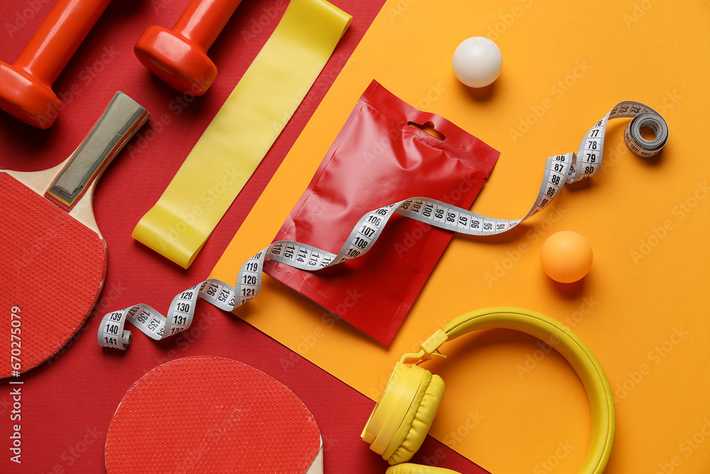 Composition with healthy snack, sports equipment and modern headphones on color background