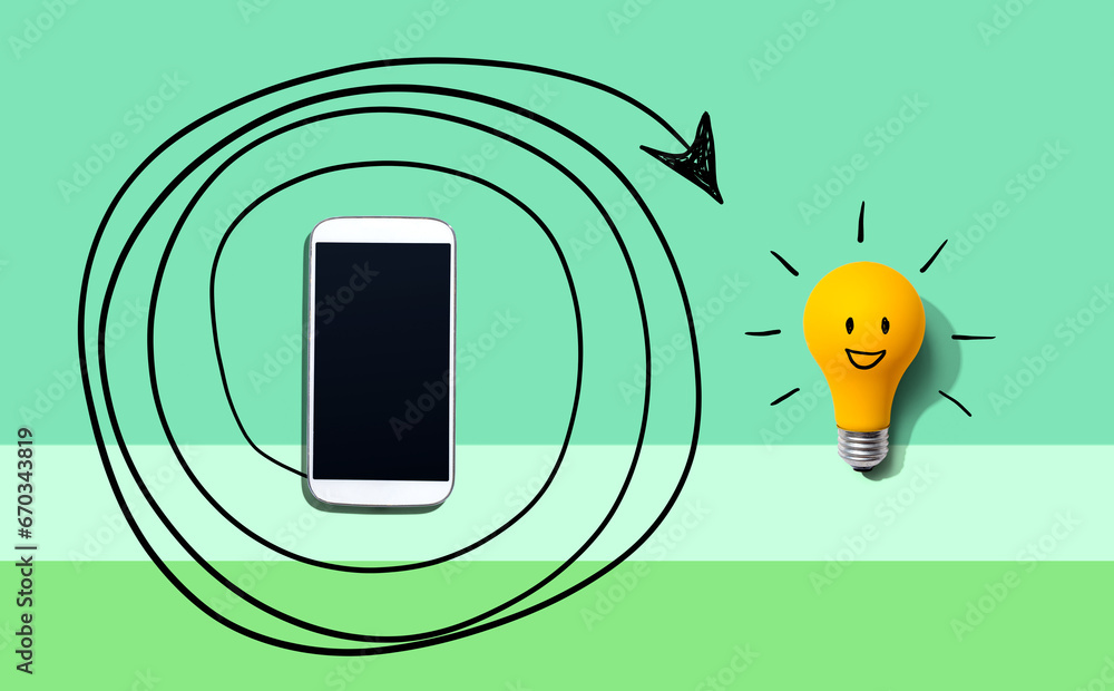 Creativity, inspiration, idea concept with light bulb and smartphone - Flat lay