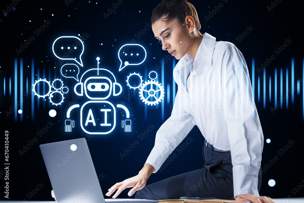 Attractive woman sitting on desk with laptop and creative glowing robot ai hologram on blurry background. Automated machine learning, artificial intelligence and conversation assistant concept.