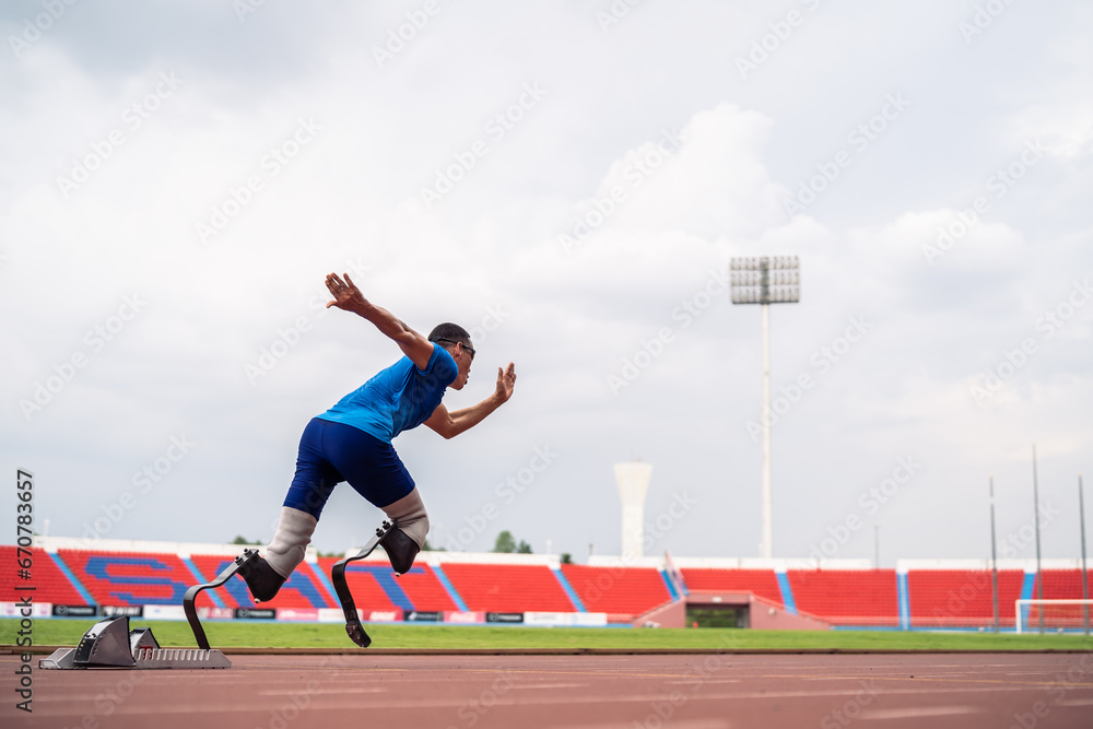 Asian athletes are disabled with prosthetic blades running at stadium. 