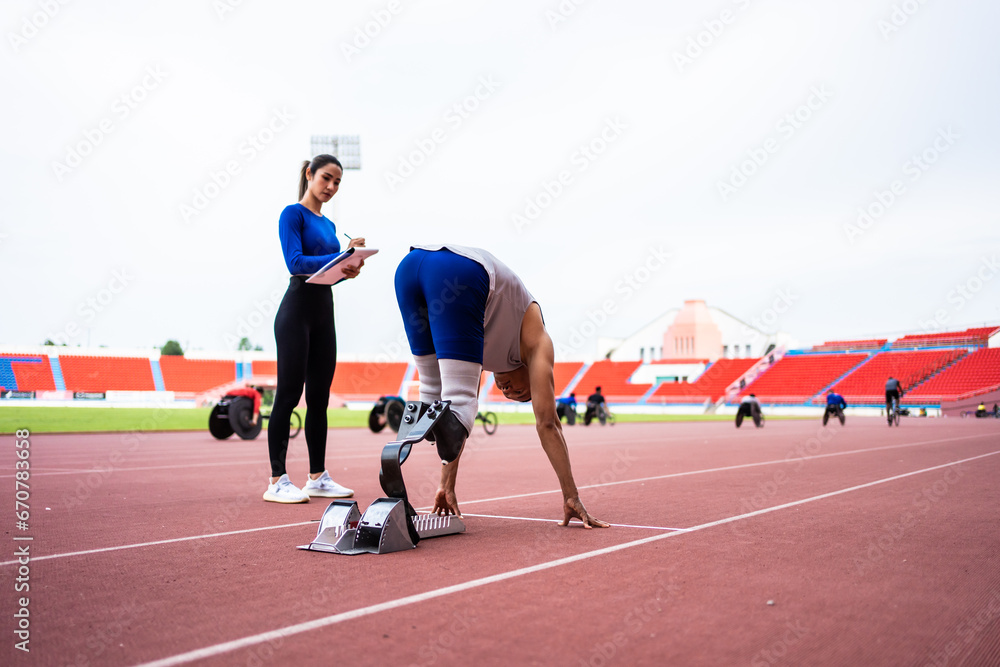 Asian athlete with prosthetic blades and trainer workout in stadium.