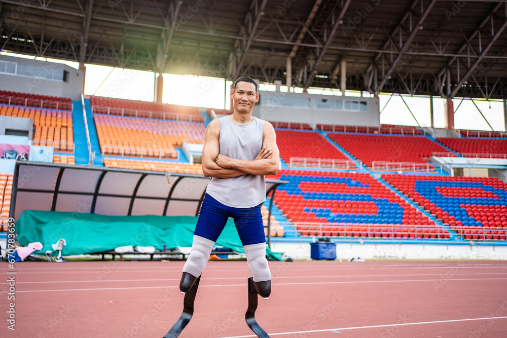 Portrait of Asian para-athletes disabled with prosthetic in stadium. 