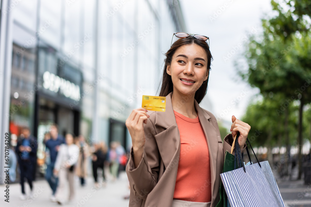 Asian beautiful woman shopping goods outdoor alone in department store. 