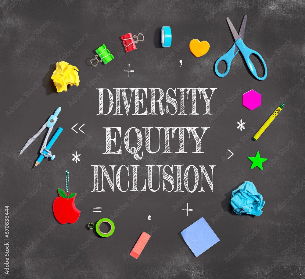 Diversity, Equity and Inclusion theme with school supplies on a chalkboard - flat lay