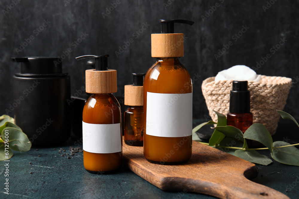 Bottles of shampoo on black background