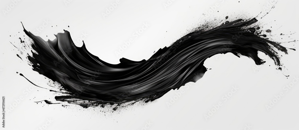 A stroke of black mascara on a white background separated from the rest