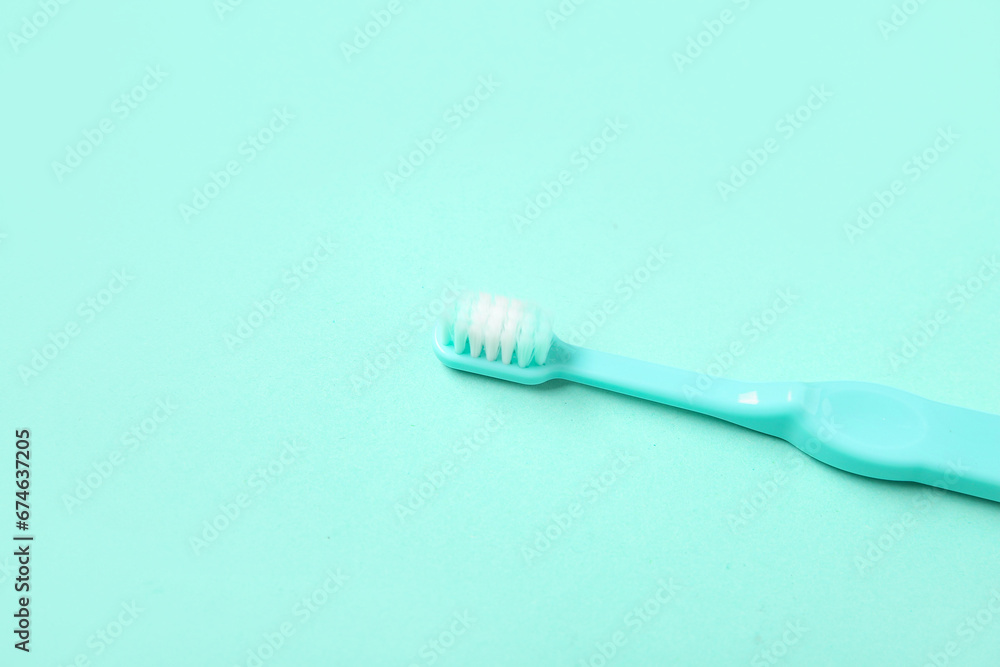 Blue toothbrush on color background.