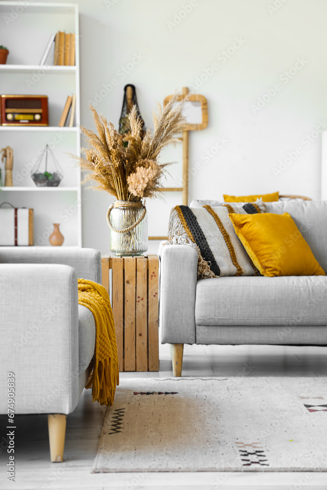 Interior of living room with grey sofas