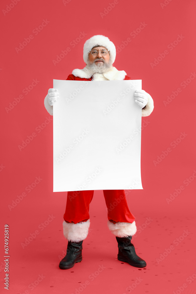 Santa Claus with blank poster on red background