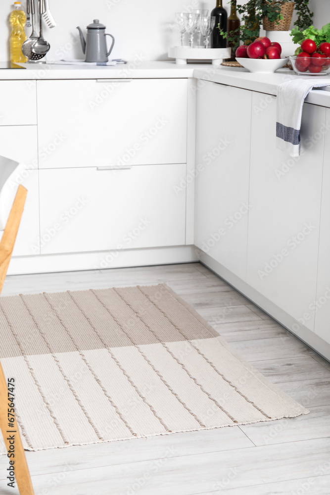 Stylish beige carpet in interior of modern kitchen