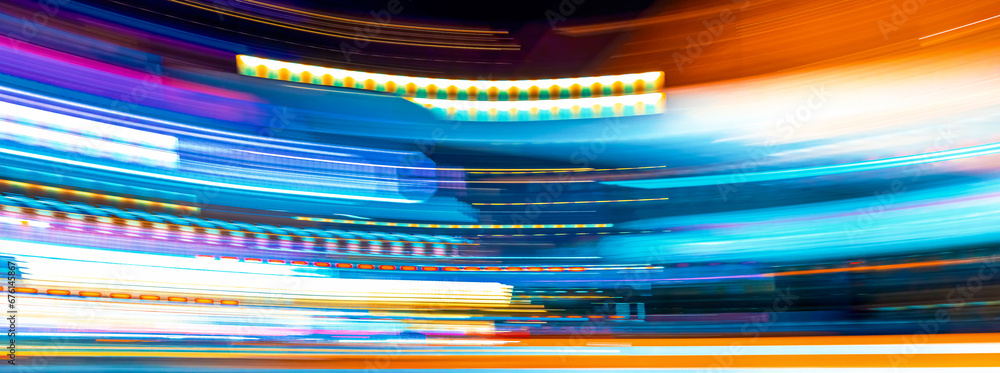 City motion blurred street intersection background at night